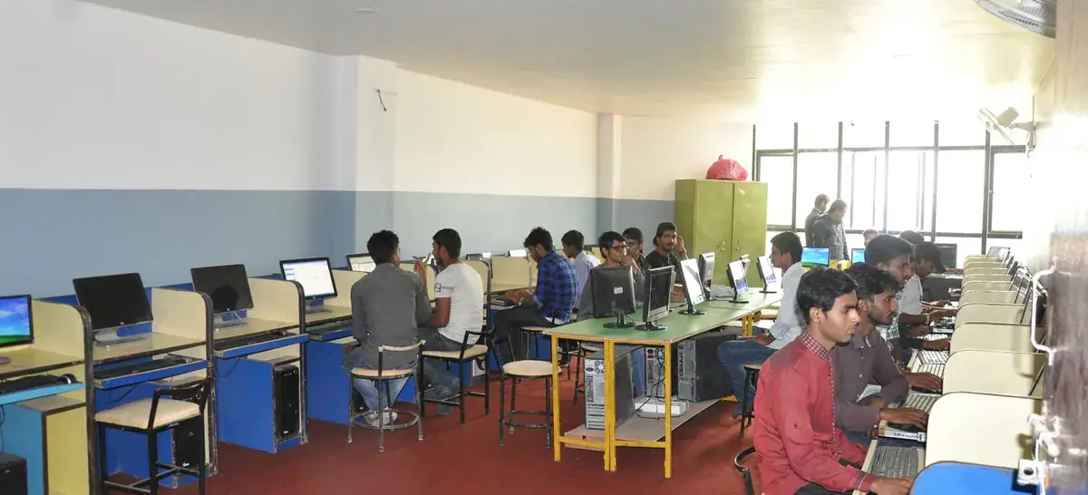 Students working at desktop machines along the benches of a computer laboratory