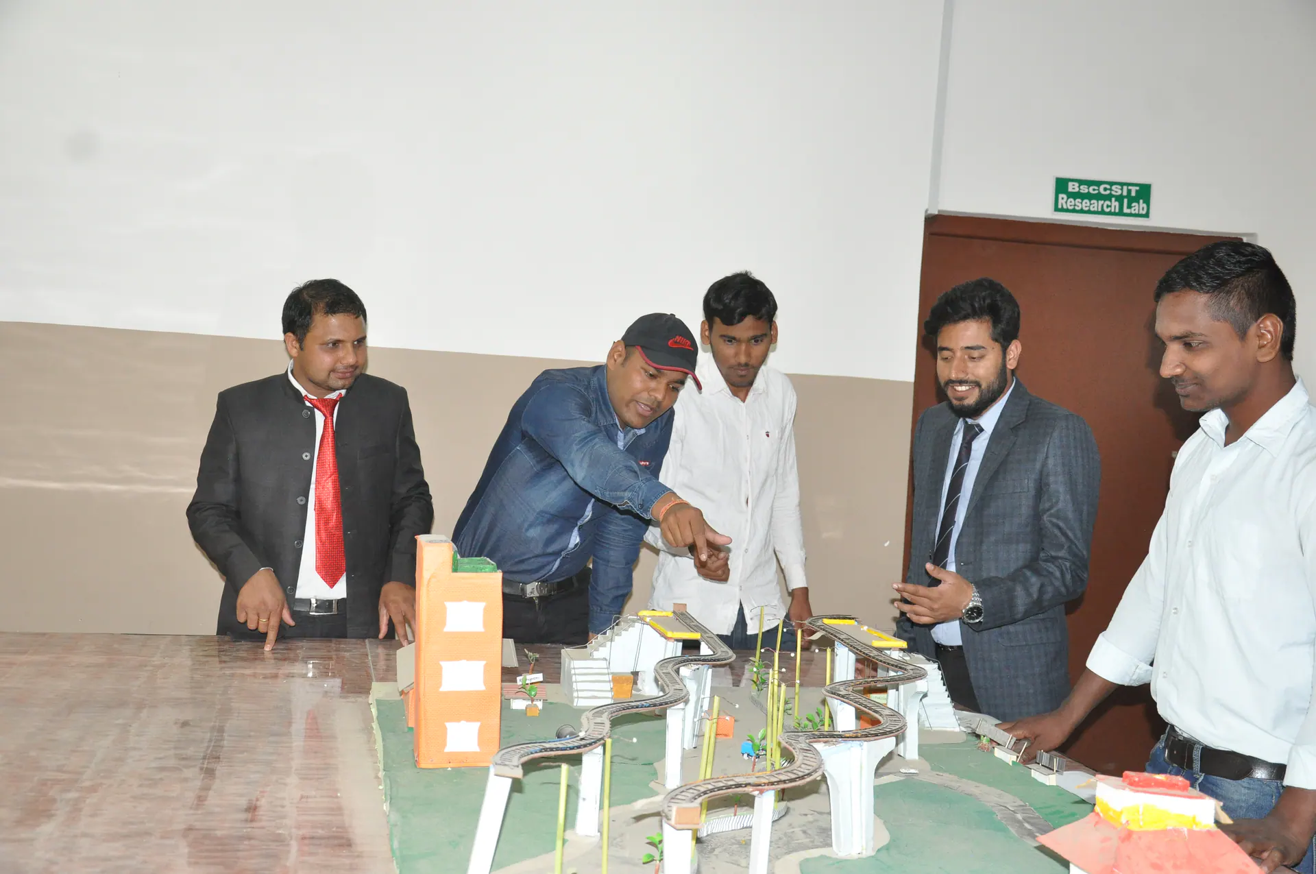 Civil engineering students reviewing an infrastructure model