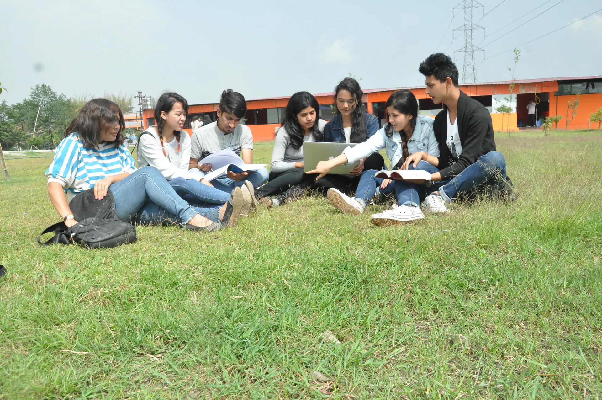 A group of ICE students studying together outdoors
